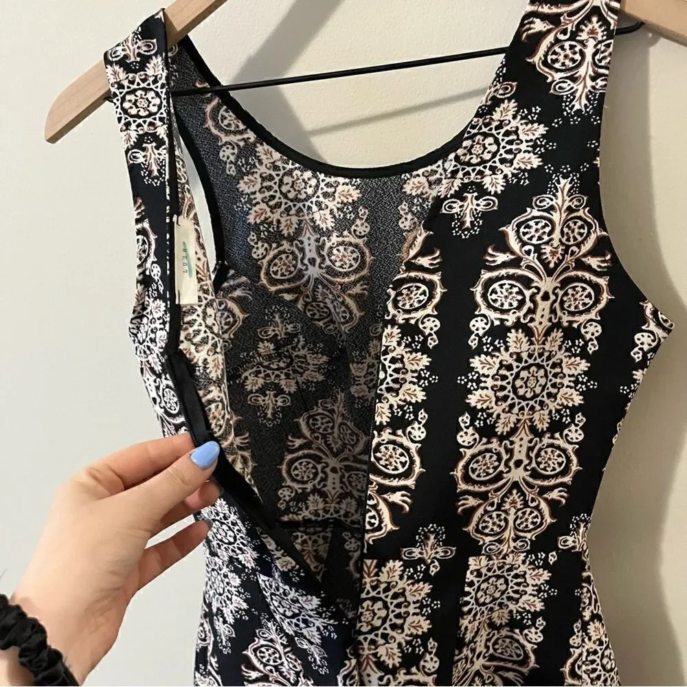 Lush  romper one piece Size small fun all over print sleeveless date